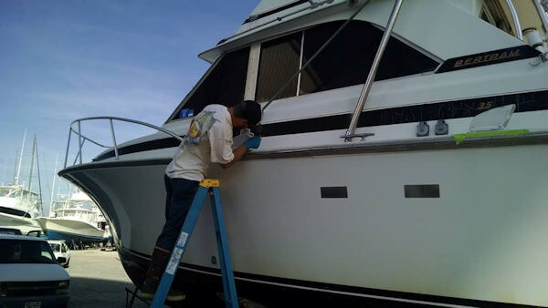 Working on the boat's exterior.