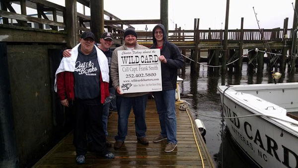 Anglers holding up our sign because we went fishless.
