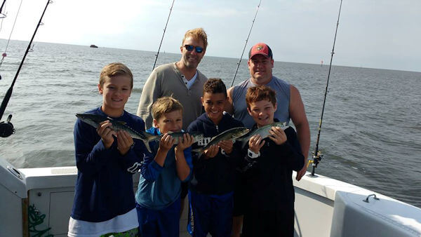 Inshore Outer Banks charter anglers showing off their catch.