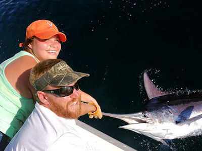 Young lady angler releases blue marlin she caught on an Oregon Inlet charter.